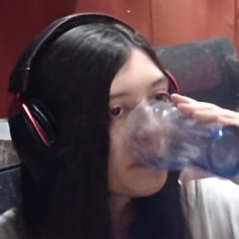 woman_drinking_headphones